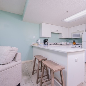 Prepare meals in your hotel room in this functional kitchen with plenty of large and small appliances, essentials, and extras