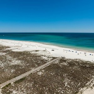 Watch the coastline stretch into the distance and the horizon meet the sky from your balcony while you soak up the sun