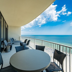Relax on the balcony and enjoy the expansive views of the tranquil water and beach below