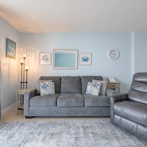 Sink into the plush sofa and enjoy the soothing coastal vibe, perfect for family movie nights and relaxation