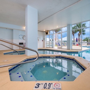 Swim through from the indoor and outdoor pool areas at The Dunes in Fort Morgan or soak in the hot tub and unwind