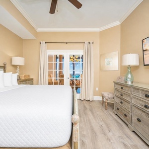 Unwind in this serene master suite, where you can stream your favorite shows while enjoying cozy bedding