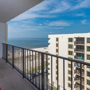 Enjoy a relaxing view from the balcony with seating, overlooking the beach and tranquil waters