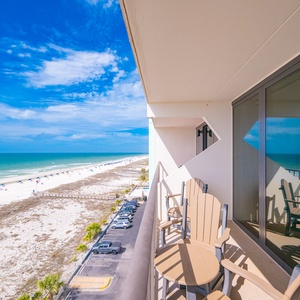 Savor the coast vibe from your balcony, soaking in expansive views and the lively beach scene below