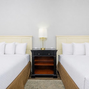 Rest in the comfortable queen beds with fluffy pillows, creating an inviting retreat for your family vacation