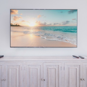 Stream your favorite shows on the large TV while relaxing on cozy furnishings that embrace you in comfort