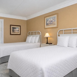Rejuvenate in this cozy guest room with two beds, perfect for restful nights after beachside adventures