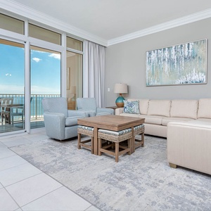 Relax in the inviting living area with a queen sofa sleeper, where comfort meets stunning coast views from the balcony