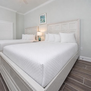 Relax on one of the cozy queen beds in this guest suite and enjoy a peaceful slumber
