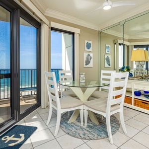 Bright sunlight pours into the dining area where you can savor meals with a view of the coast breeze