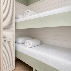 Twin bunk beds in the living space create a cozy nook, ideal for kids or extra guests in this charming vacation rental