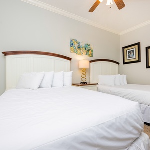 Drift into restful sleep in this guest suite with a queen and a double bed, where comfort awaits