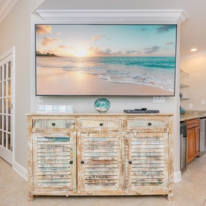Unwind in the cozy seating as you enjoy your favorite shows while soaking in the beach vibes and decor