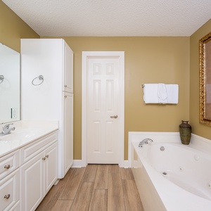 Indulge in a rejuvenating soak in the jetted tub in the master, surrounded by soothing decor and inviting warmth