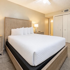 Neutral tones and bedside lamps create a soothing retreat in your queen guest suite for restful nights