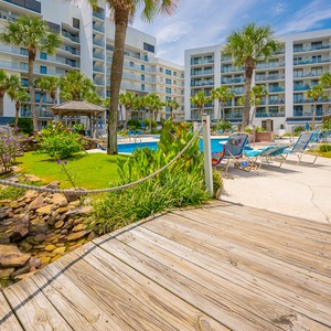 Walkway to the sparkling pool on the property