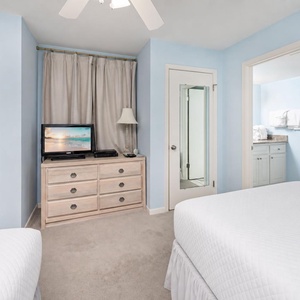 Quiet comfort surrounds you in the guest suite as you watch a favorite movie after a day at the shore
