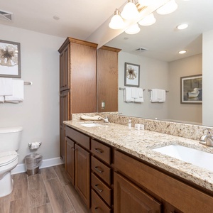 Experience a refreshing retreat in the master bathroom, featuring a double vanity, relaxing tub, and soothing shower