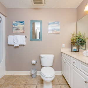 Refresh in this guest bath, indulging in soothing moments with plush towels and coastal-inspired decor