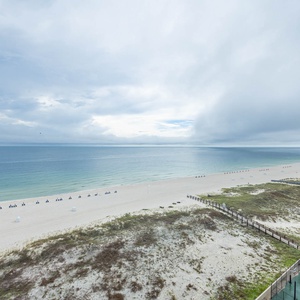 Enjoy stunning views of the tranquil waters and beach from your spacious balcony, perfect for relaxation and unwinding