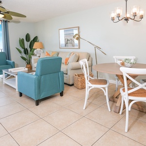 Relax in the bright living area with comfortable seating, a dining table, and views that invite you to unwind