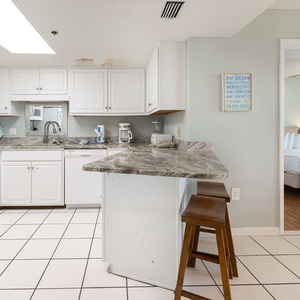 Create delicious meals and drinks at the granite countertops, while soaking in the beach vibe from the open layout