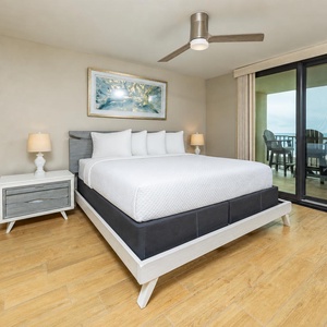 Drift into relaxation in the king master suite, feeling the gentle breeze from your balcony