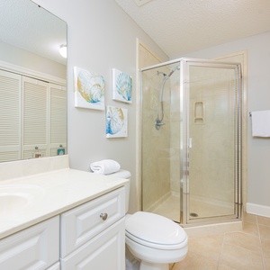 Refresh in this additional guest bath with a walk-in shower and laundry area with a washer and dryer in your rental