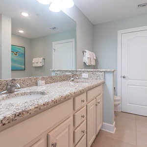 Refresh in the master bath after a day at the beach with a soothing jetted tub and relaxing walk-in shower