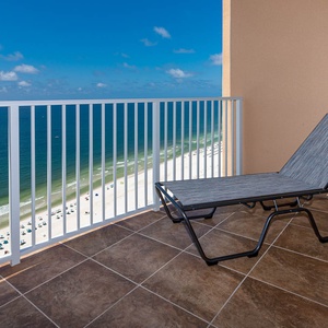 Lounge on the balcony chair, soaking up warm breezes and captivating coast views while you unwind