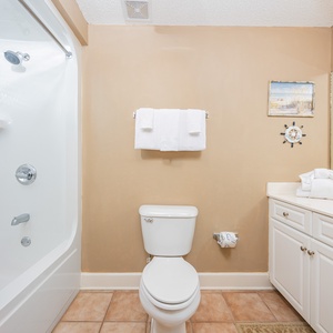 Enjoy a relaxing shower after a day of adventure in this guest bath with stylish accents and fluffy towels