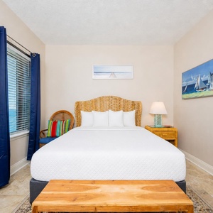 Drift into restful nights in this guest bedroom, where the queen bed awaits your return from beach adventures