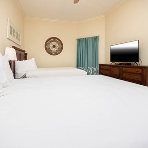 Unwind in this queen guest suite and stream your favorite shows or enjoy a good movie after a beach day
