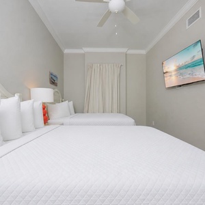 Stretch out on one of the queen beds and relax with your favorite show