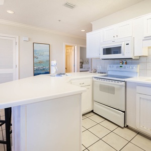 Prepare meals in this bright kitchen with ample counter space and a welcoming atmosphere for family gatherings