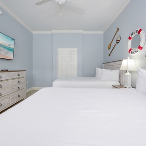 Sink into a soft queen bed in this guest suite, perfect for rejuvenating nights after beach adventures