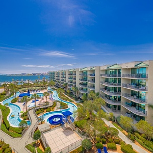 Discover the pool area with a refreshing lazy river and thrilling waterslide, just steps from the bay