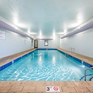 Cool off in the indoor pool with stunning views of the beach and palm trees just beyond the large windows