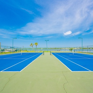 Enjoy a friendly game of tennis while soaking up the sunshine