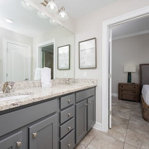Freshen up in this guest bath in the relaxing shower or soothing tub before an exciting beach day
