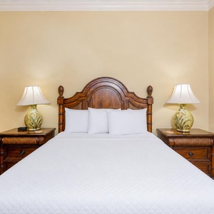 Rest in comfort in this queen guest suite, surrounded by warm lighting and serene decor that invites a peaceful retreat