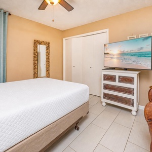 Plush queen guest suite offers a restful retreat where you can unwind and stream favorite shows