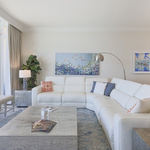 Relax on the sectional, flip magazines on the coffee table, and let gulf light pour through the tall windows