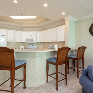 Enjoy morning coffee at the breakfast bar, where the coastal vibe makes every moment special