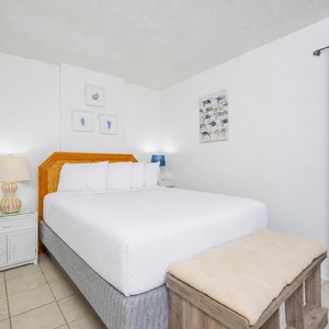 Drift into bliss in this queen guest suite, enveloped in soft linens, as you savor the calming beach vibe around you