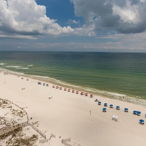Enjoy views of the beach with colorful umbrellas inviting you to enjoy the sun and beachside activities