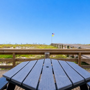 Enjoy a meal outdoors at the Pollywood picnic table, located beachside near the frilling area