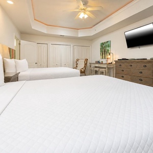 Unwind in the bedroom, where soft bedding invites peaceful sleep, and catch a good movie