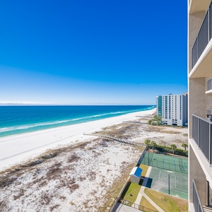 Breathtaking balcony view of the turquoise waters and beach, perfect for relaxation on your beach getaway