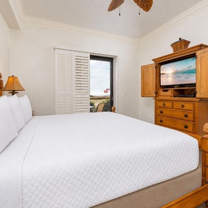 A king master suite where you sink into crisp linens and watch beach scenes flicker on the TV